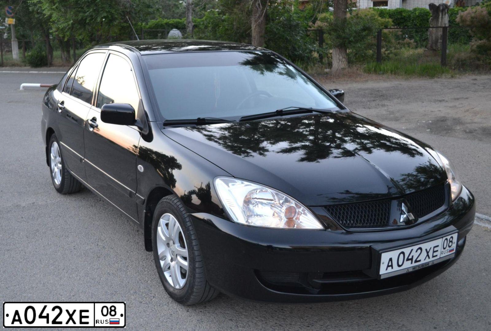 Фото автомобиля MITSUBISHI LANCER, 2007 — госномер А042ХЕ08. Цвет: ЧЕРНЫЙ