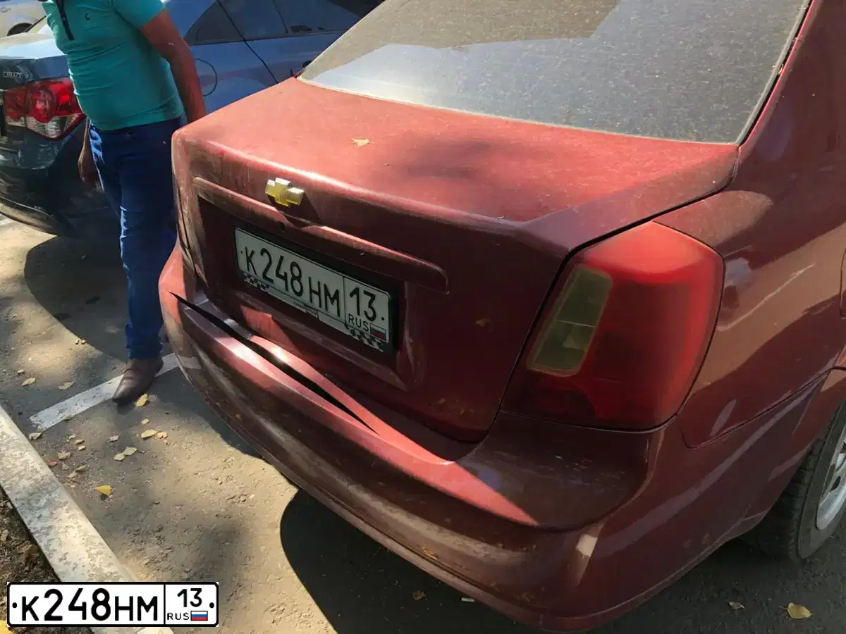 Фото автомобиля CHEVROLET LACETTI, 2006 — госномер К248НМ13. Цвет: ТЕМНО - КРАСНЫЙ