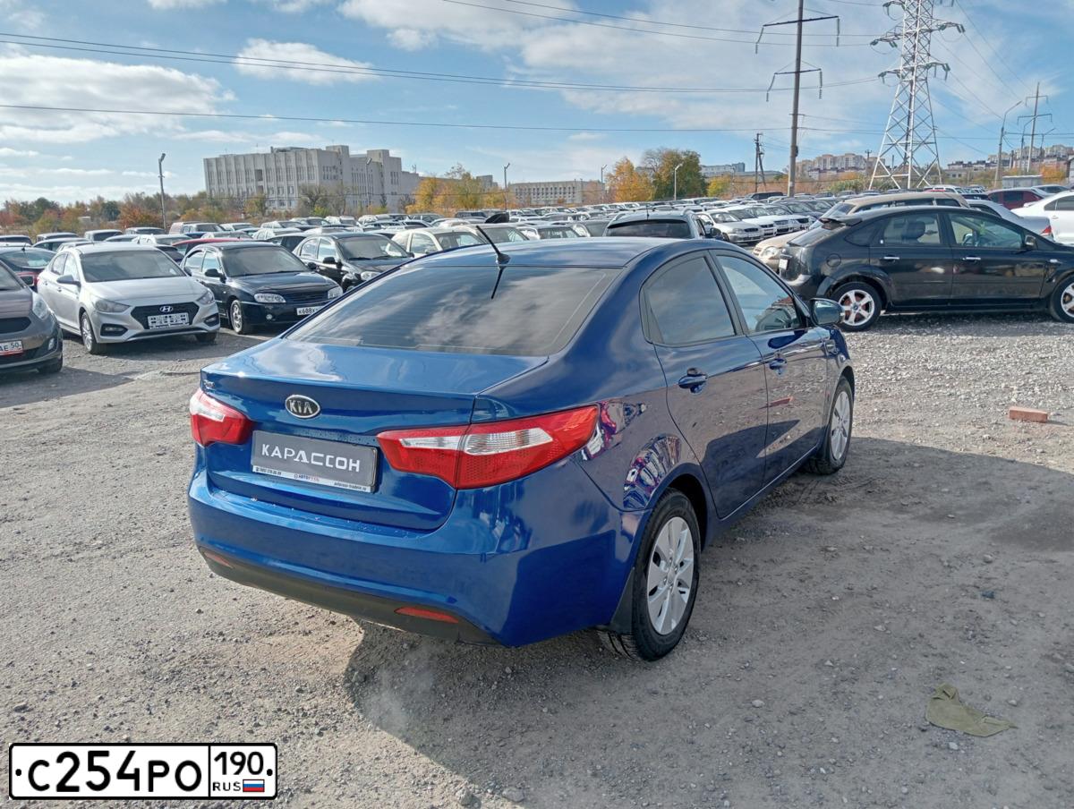 Фото автомобиля KIA RIO, 2012 — госномер Н220ЕС134. Цвет: синий