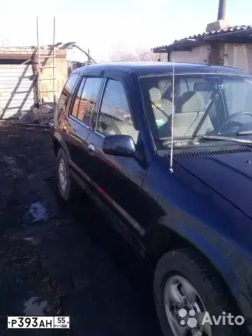 Фото автомобиля KIA SPORTAGE, 1996 — госномер А393ХУ155. Цвет: синий