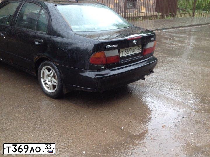 Фото автомобиля NISSAN ALMERA, 1997 — госномер Р282ЕК57. Цвет: ЧЕРНЫЙ