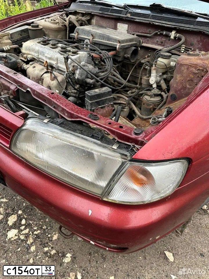 Фото автомобиля NISSAN ALMERA, 1996 — госномер О306ТТ790. Цвет: ТЕМНО-КРАСНЫЙ