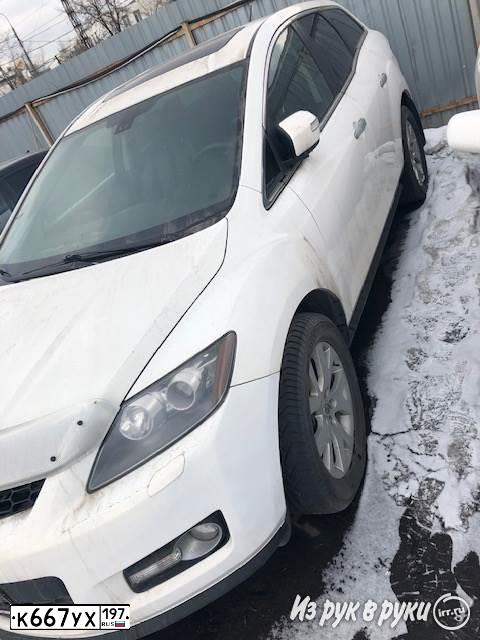 Фото автомобиля MAZDA CX-7, 2008 — госномер У552АВ774. Цвет: Белый