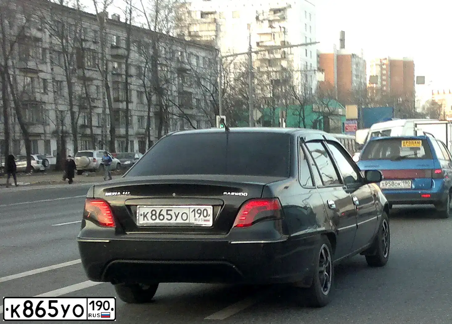 Фото автомобиля DAEWOO O NEXIA, 2009 — госномер К865УО190. Цвет: ЧЕРНЫЙ