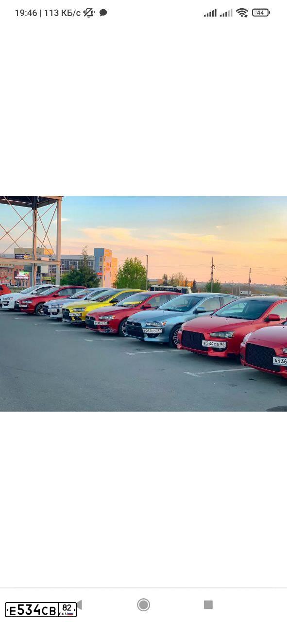 Фото автомобиля MITSUBISHI LANCER, 2007 — госномер Е534СВ82. Цвет: КРАСНЫЙ