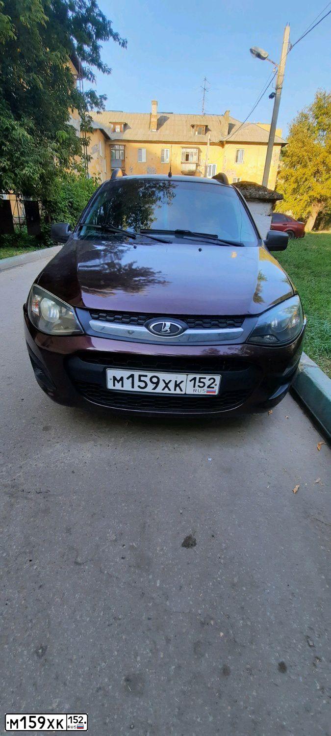 Фото автомобиля LADA 2192 KALINA, 2013 — госномер М128МК21. Цвет: ТЕМНО-ВИШНЕВЫЙ