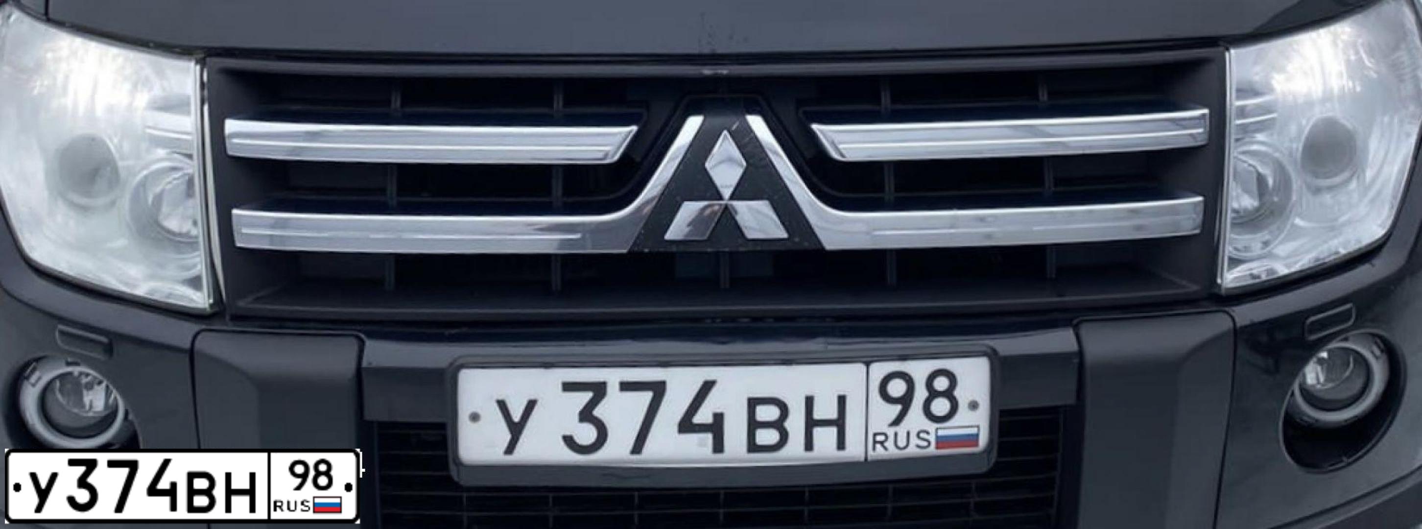 Фото автомобиля MITSUBISHI PAJERO, 2008 — госномер О410ХЕ29. Цвет: ЧЕРНЫЙ