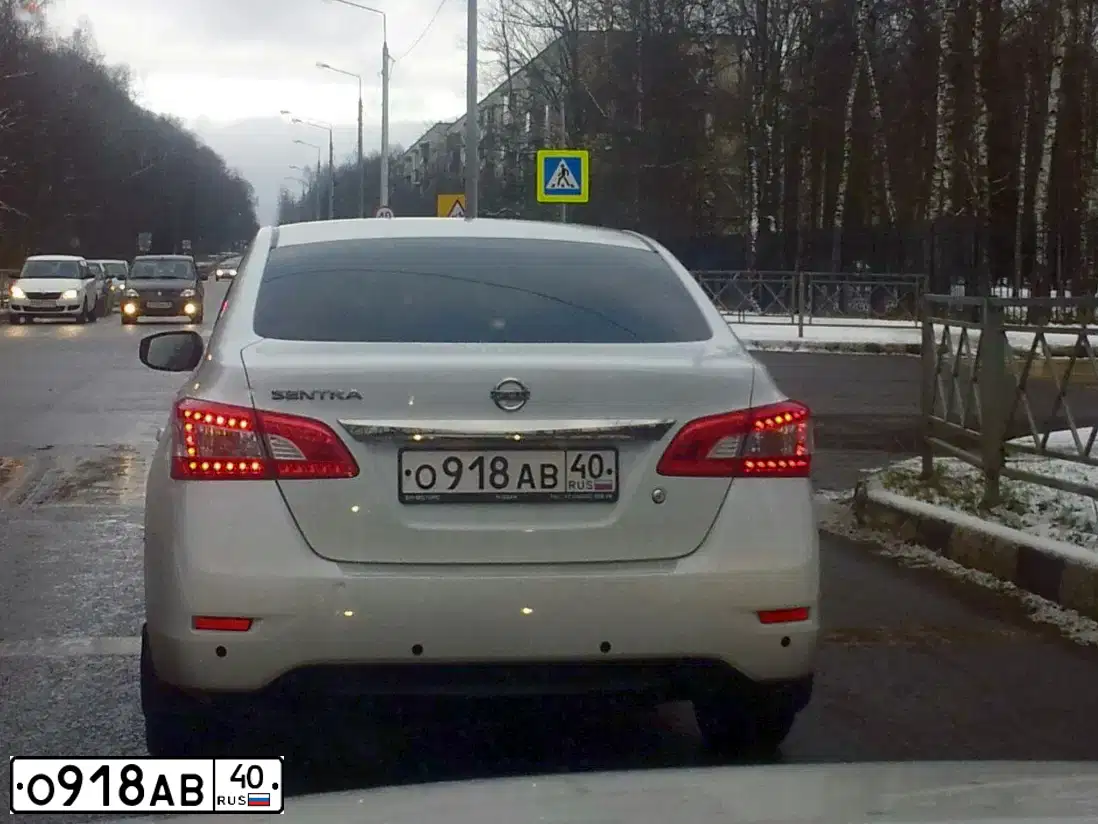 Фото автомобиля NISSAN SENTRA/LUCINO/, 2015 — госномер О918АВ40. Цвет: БЕЛЫЙ