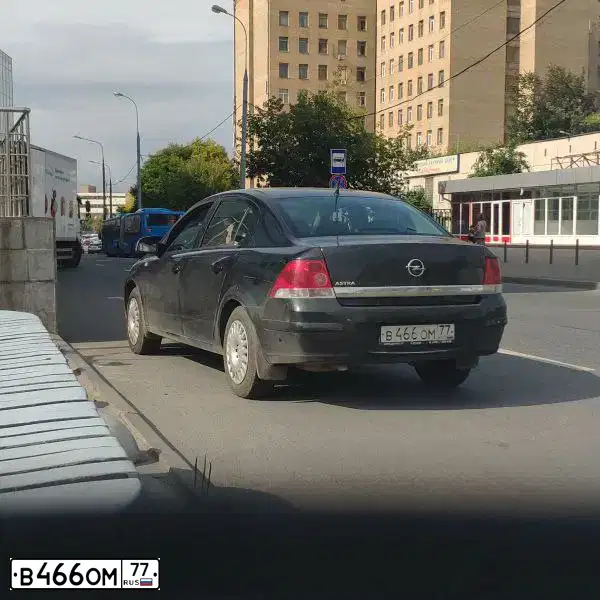 Фото автомобиля OPEL ASTRA, 2012 — госномер Е561ЕХ702. Цвет: ЧЕРНЫЙ