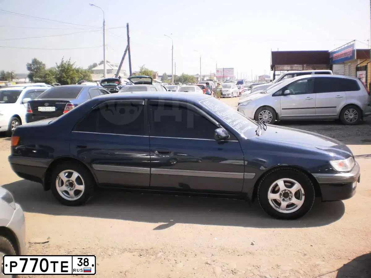Фото автомобиля TOYOTA COROLLA, 2001 — госномер Т532КУ138. Цвет: синий