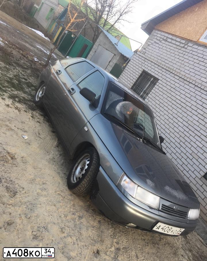 Фото автомобиля LADA 2112, 2005 — госномер Е118ОО134. Цвет: средний серо-зеленый металлик