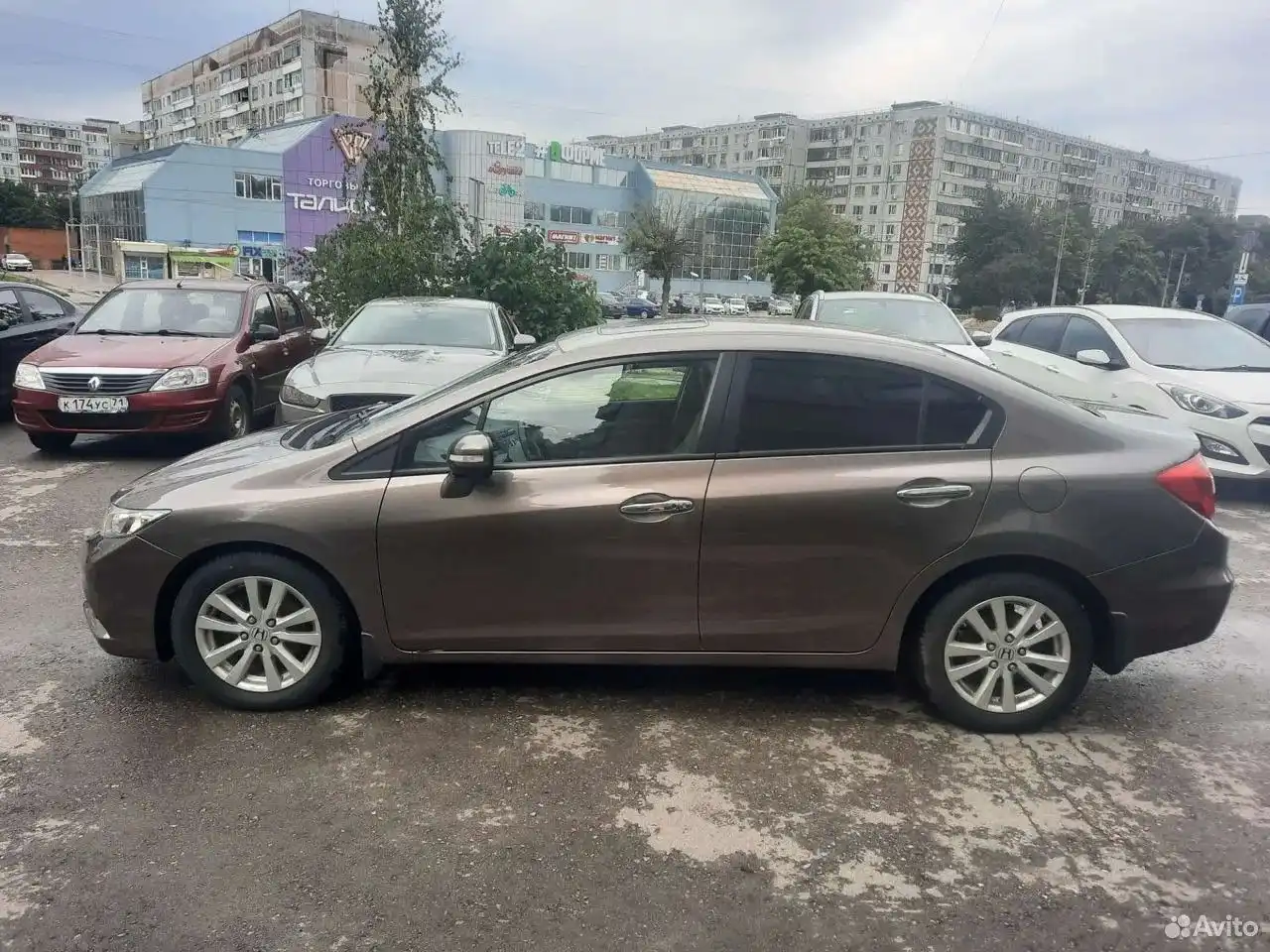 Фото автомобиля RENAULT LOGAN, 2010 — госномер К174УС71. Цвет: Красный
