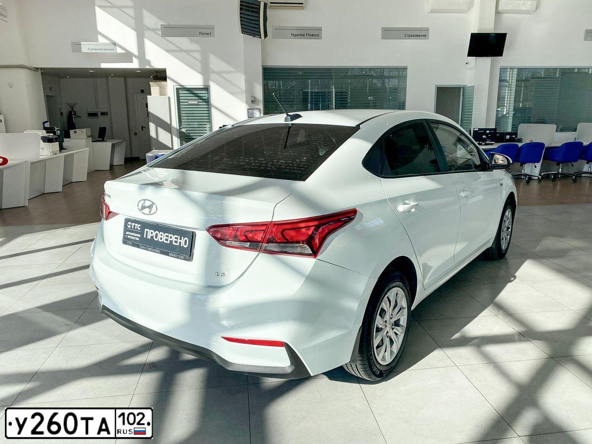 Фото автомобиля HYUNDAI SOLARIS, 2017 — госномер Н719МЕ702. Цвет: Белый