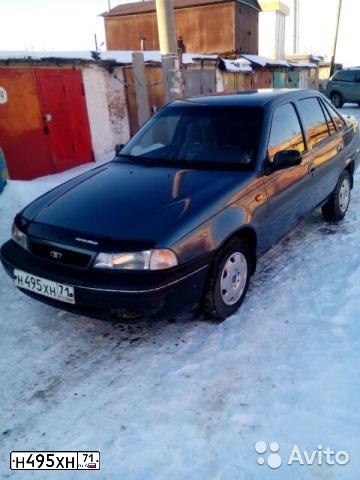 Фото автомобиля DAEWOO NEXIA, 1997 — госномер Е424МС71. Цвет: СЕРО-ЗЕЛЕНЫЙ