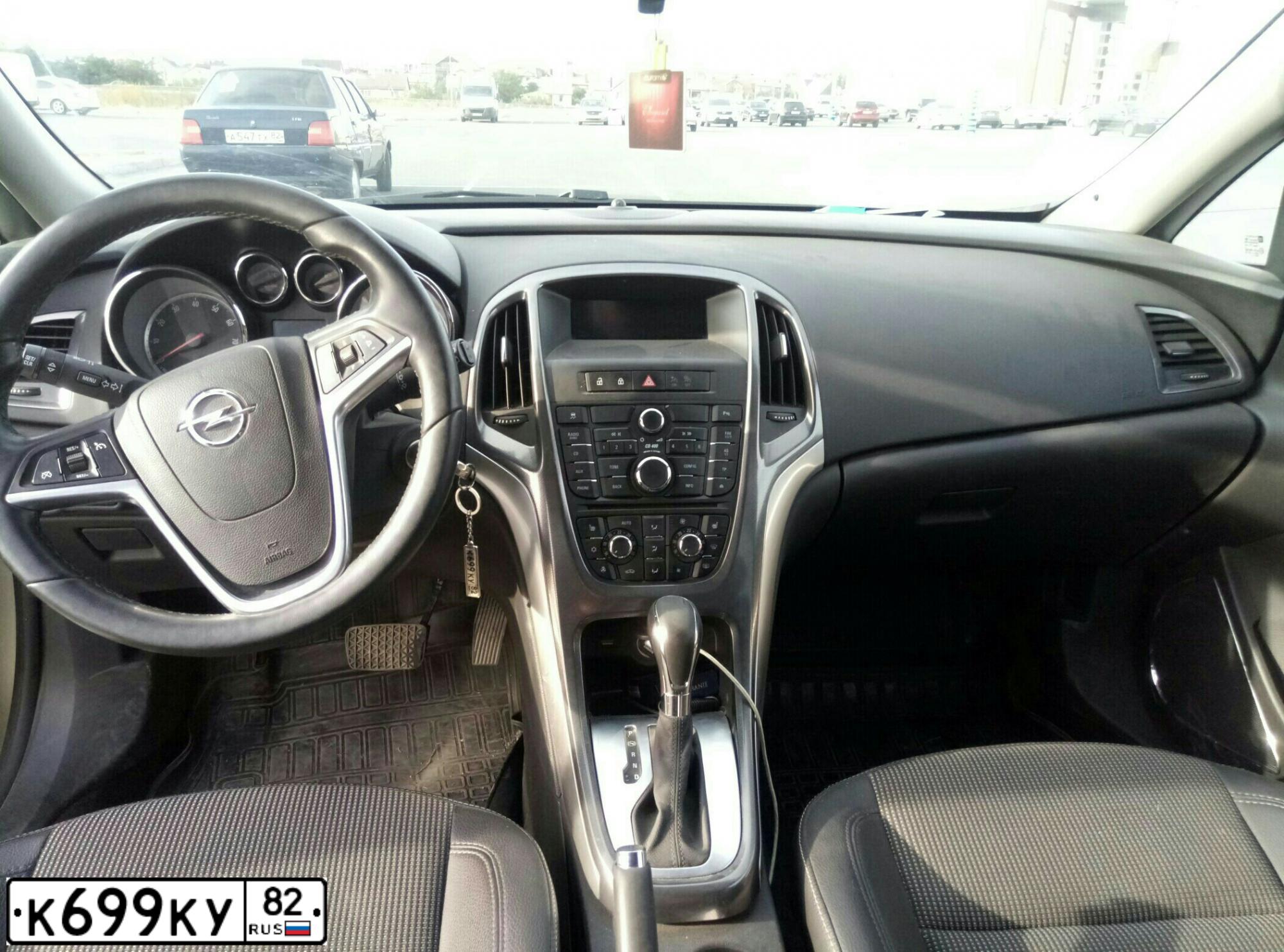 Фото автомобиля OPEL ASTRA, 2011 — госномер К699КУ82. Цвет: БЕЖЕВЫЙ МЕТАЛЛИК