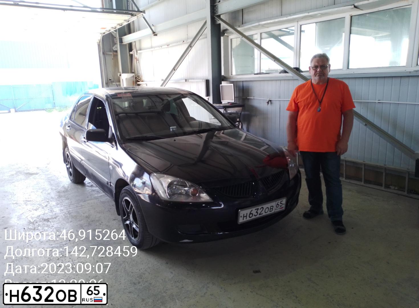 Фото автомобиля MITSUBISHI LANCER, 2009 — госномер Н055СК65. Цвет: ЧЕРНЫЙ
