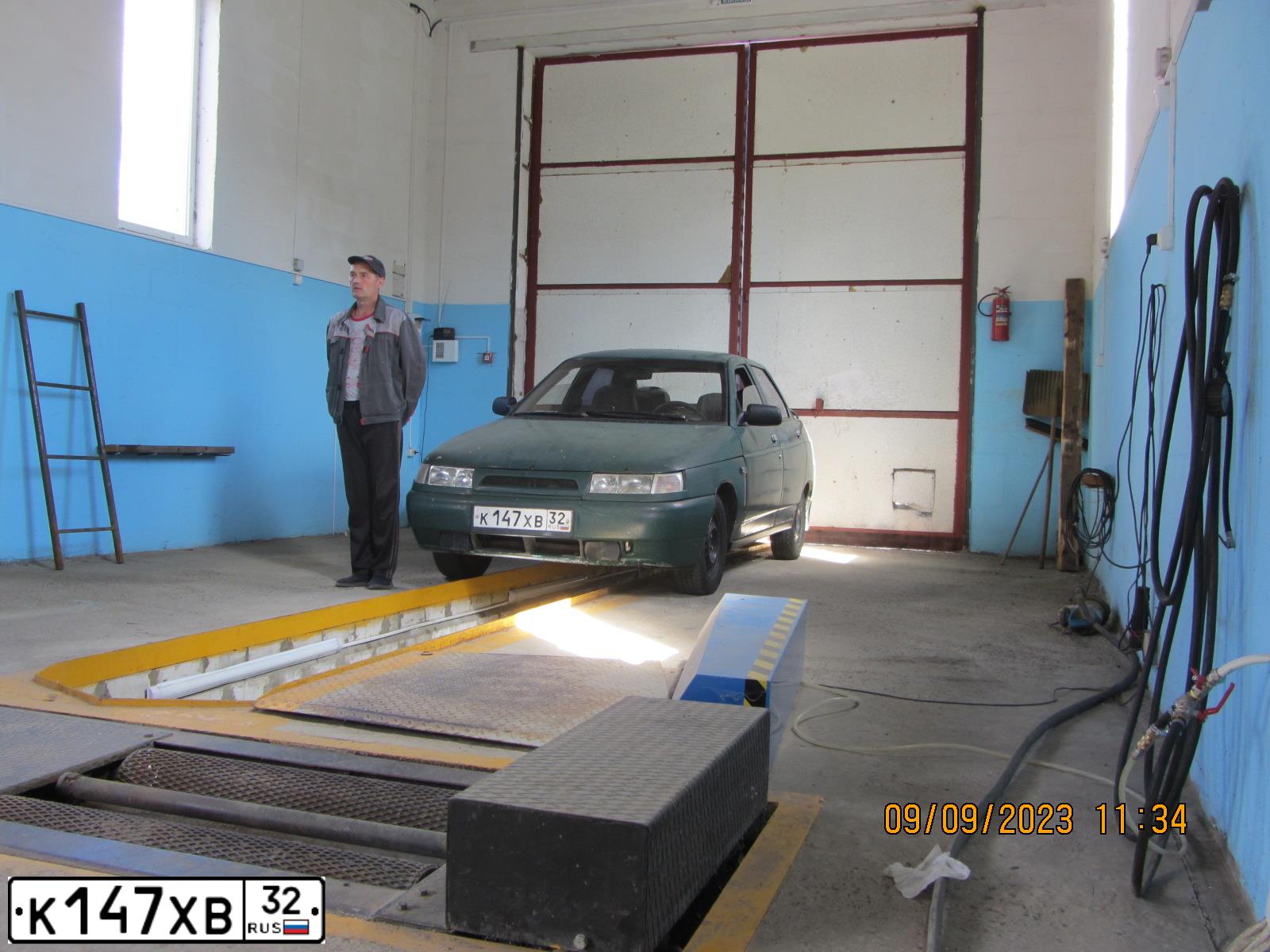 Фото автомобиля LADA 2110, 2002 — госномер О248ОМ32. Цвет: Темно-зеленый