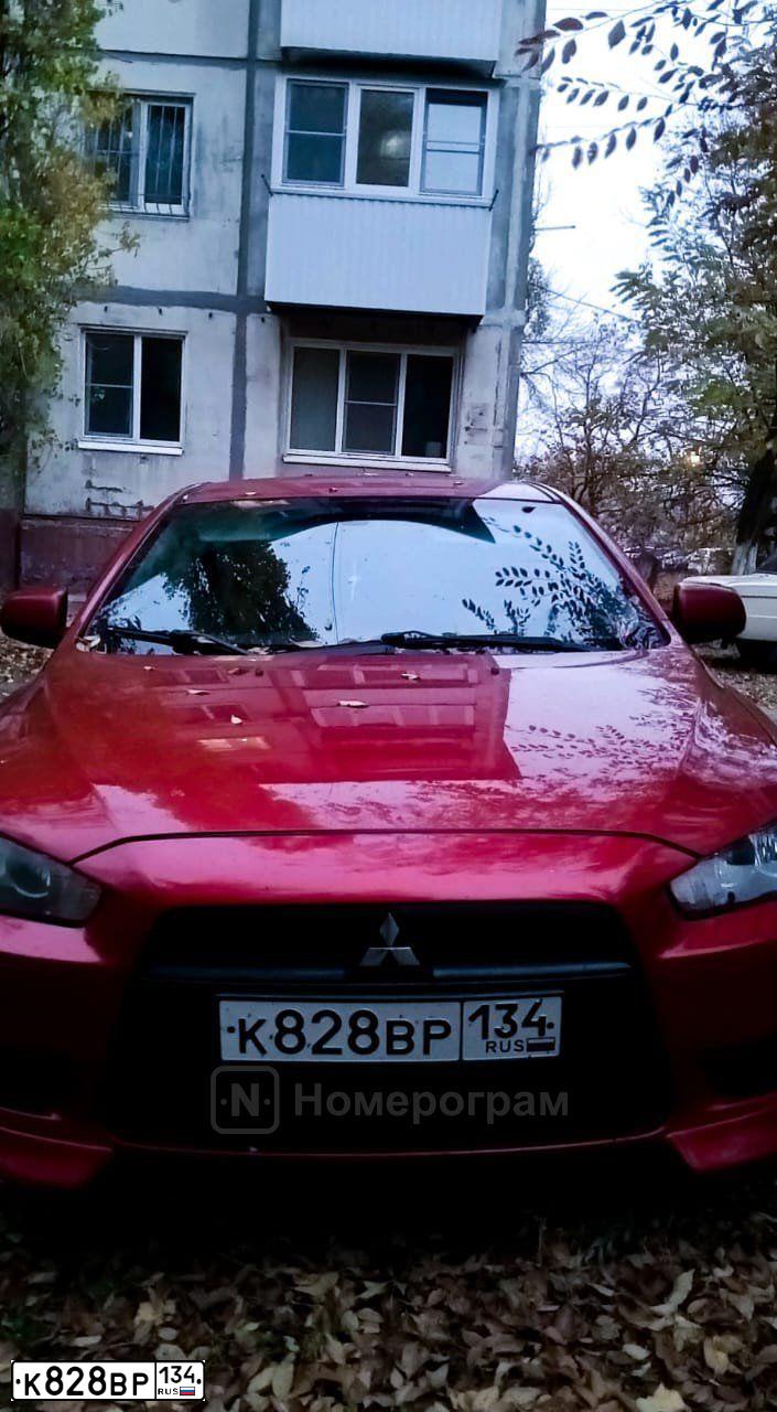 Фото автомобиля MITSUBISHI LANCER, 2008 — госномер К828ВР134. Цвет: Красный