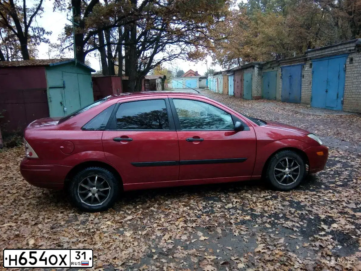 Фото автомобиля FORD FOCUS, 1999 — госномер Н654ОХ31. Цвет: КРАСНЫЙ