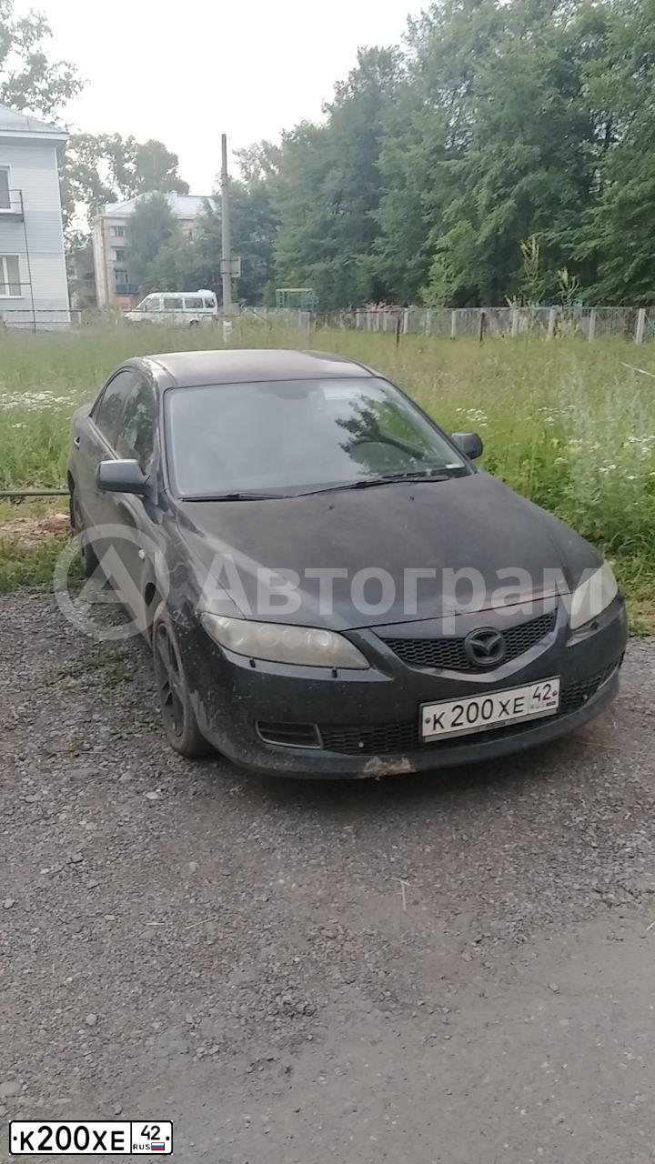Фото автомобиля FORD FOCUS, 2005 — госномер К200ХЕ42. Цвет: СВЕТЛО-СЕРО-ГОЛУБОЙ
