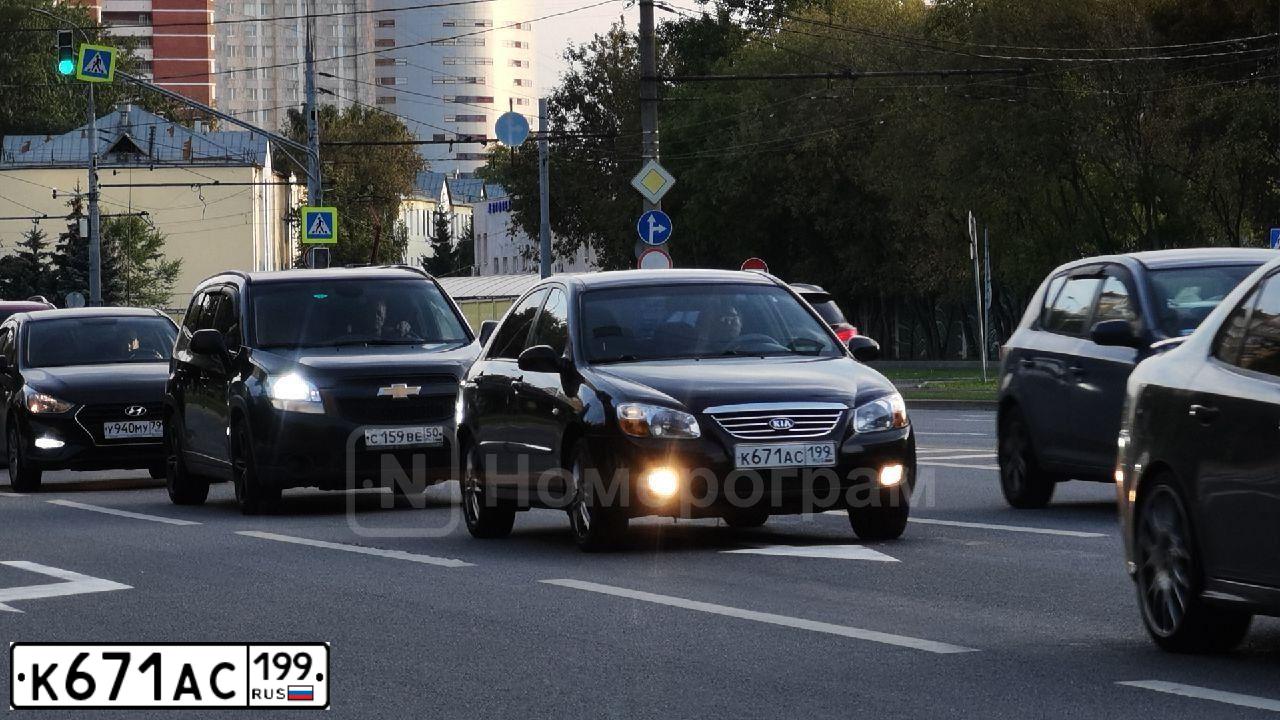 Фото автомобиля KIA CERATO, 2007 — госномер К671АС199. Цвет: ЧЕРНЫЙ