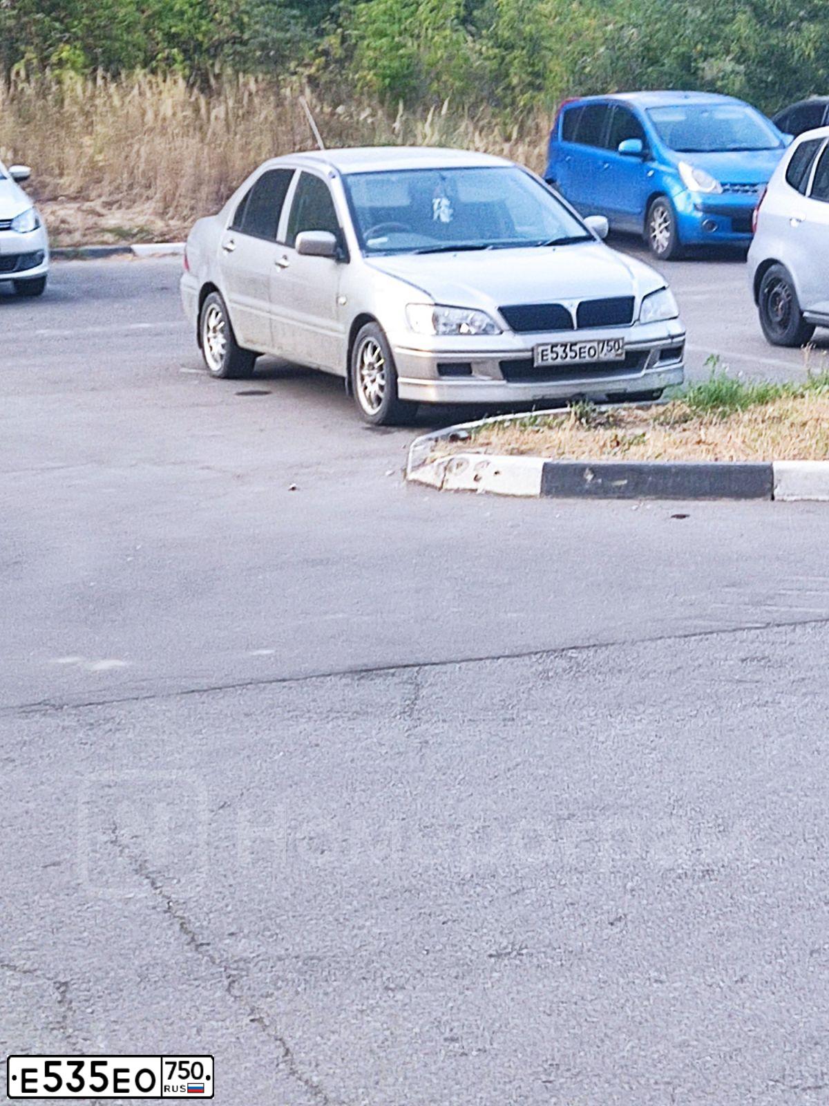 Фото автомобиля MITSUBISHI LANCER, 2002 — госномер Е535ЕО750. Цвет: ЖЕЛТЫЙ