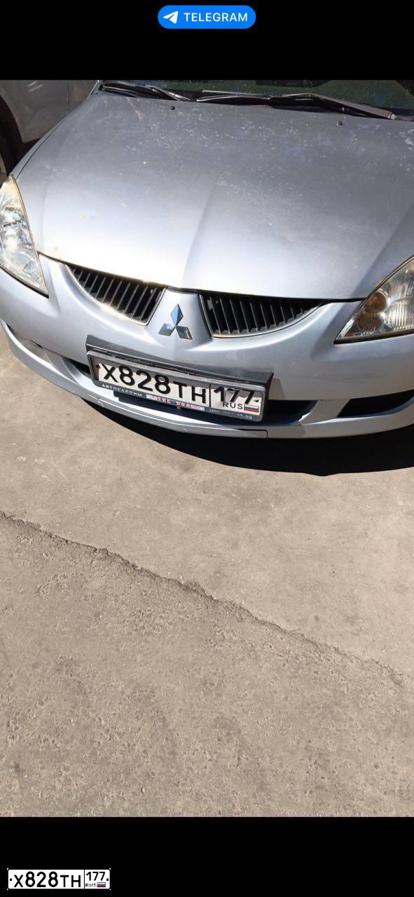Фото автомобиля MITSUBISHI LANCER, 2005 — госномер Х828ТН177. Цвет: СЕРЕБРИСТЫЙ МЕТАЛЛИК