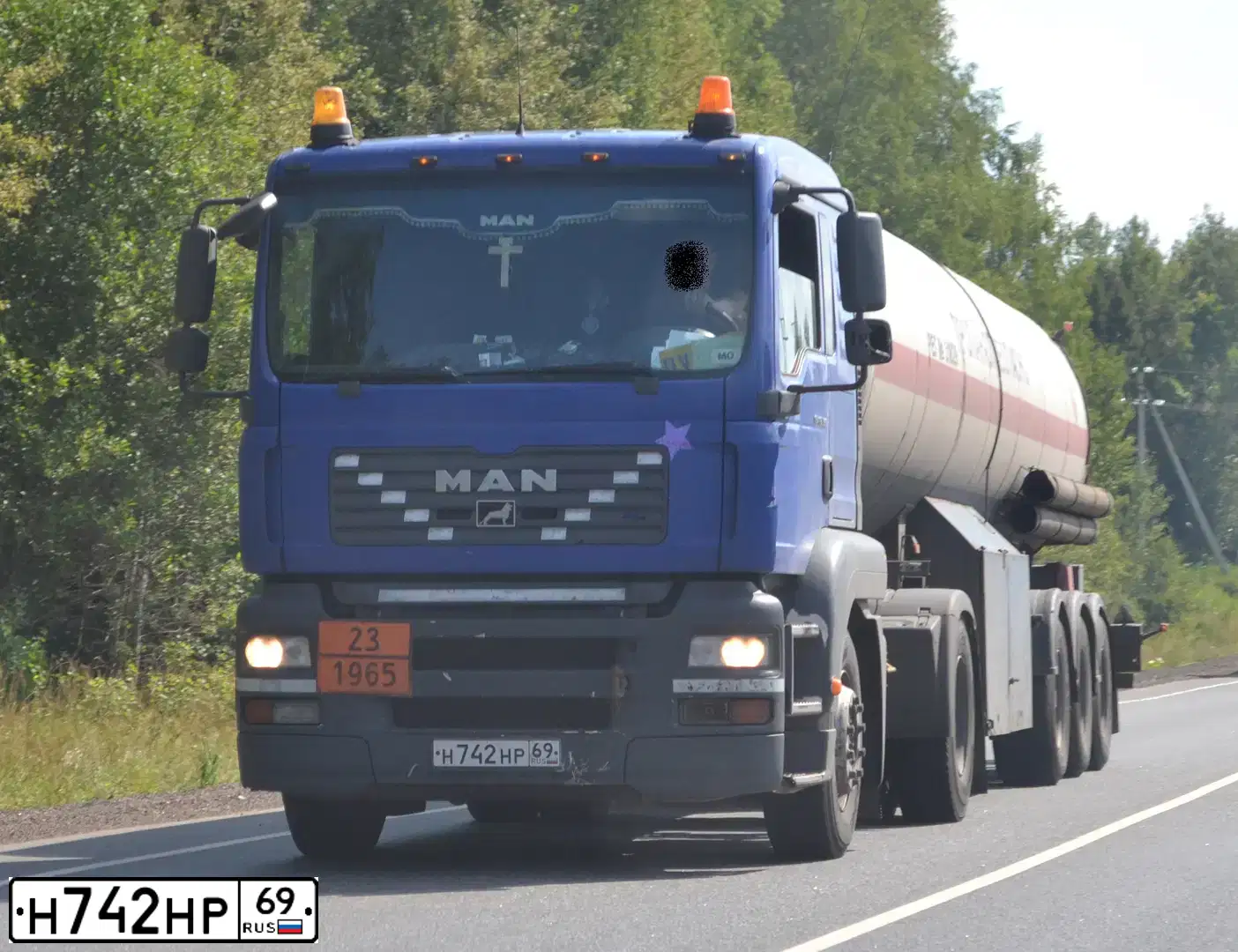 Фото автомобиля MAN TGX 18.XXX /4X2/, 2014 — госномер К959АТ790. Цвет: Белый