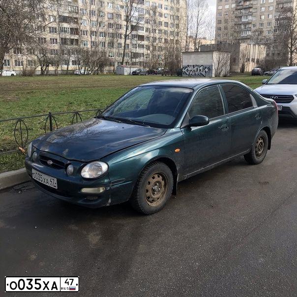 Фото автомобиля KIA SHUMA, 1999 — госномер Х010ХК98. Цвет: Темно-зеленый