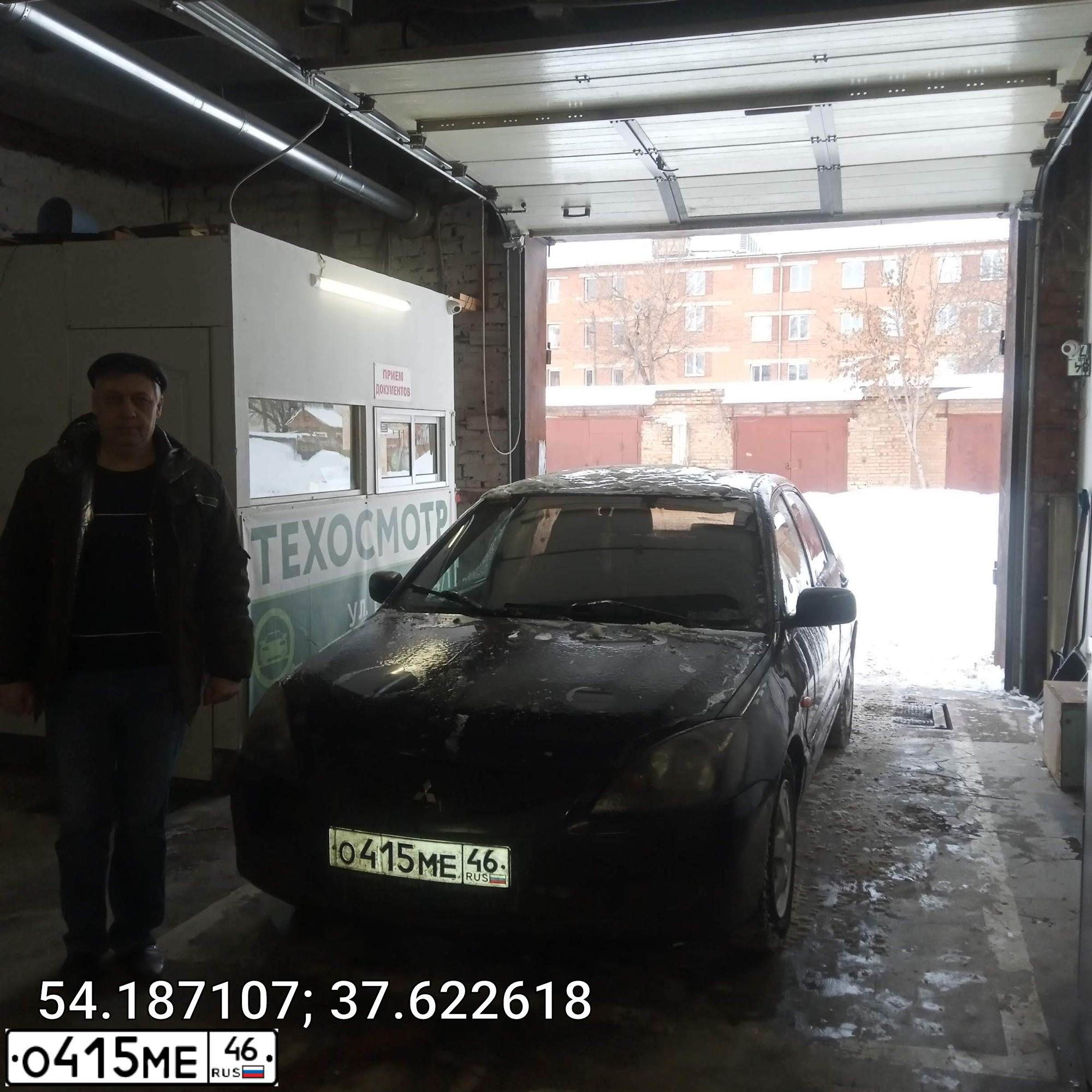 Фото автомобиля MITSUBISHI LANCER, 2004 — госномер О123МУ71. Цвет: ЧЕРНЫЙ