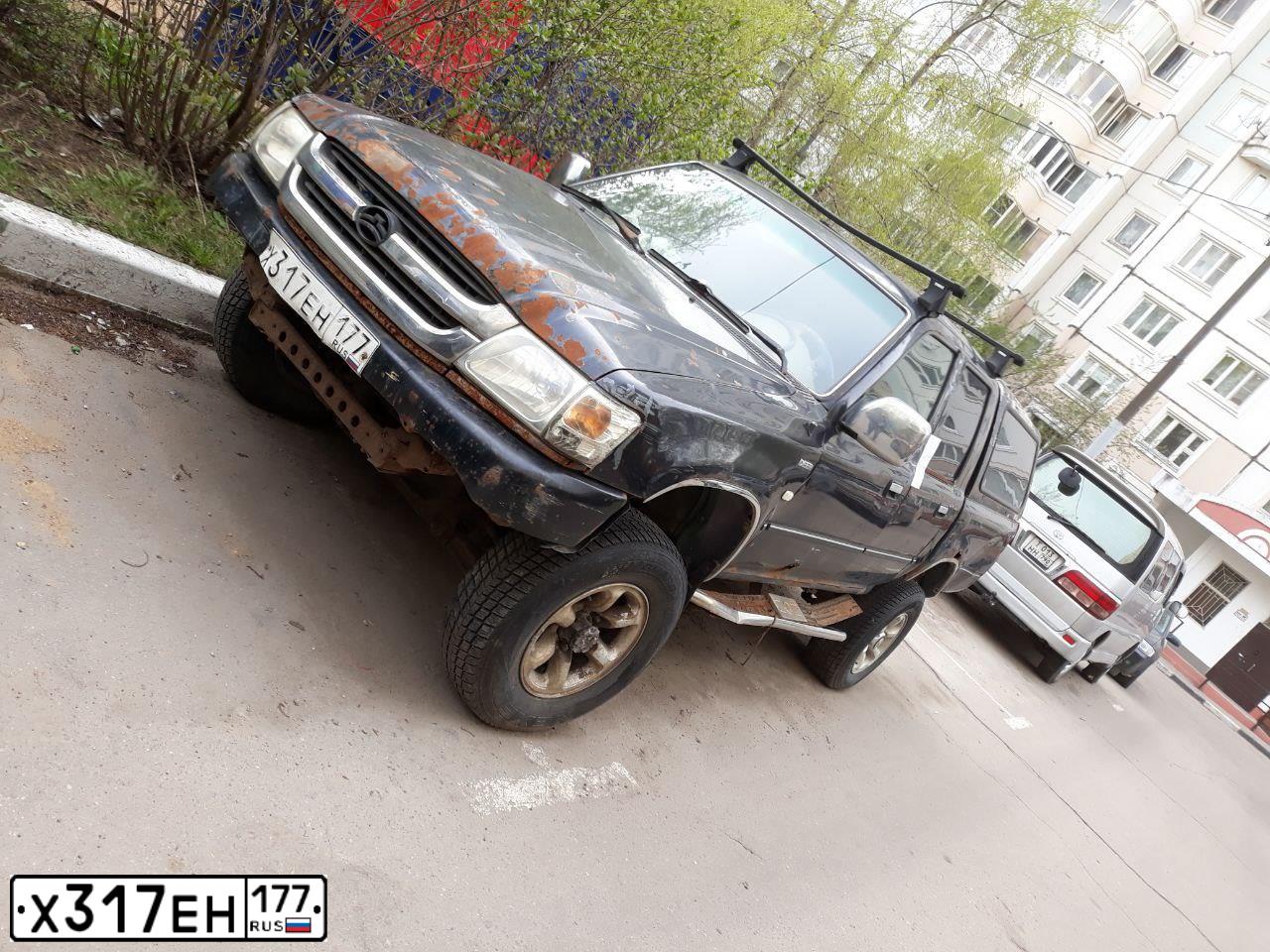 Фото автомобиля GREAT WALL DEER, 2005 — госномер Х317ЕН177. Цвет: ЧЕРНЫЙ