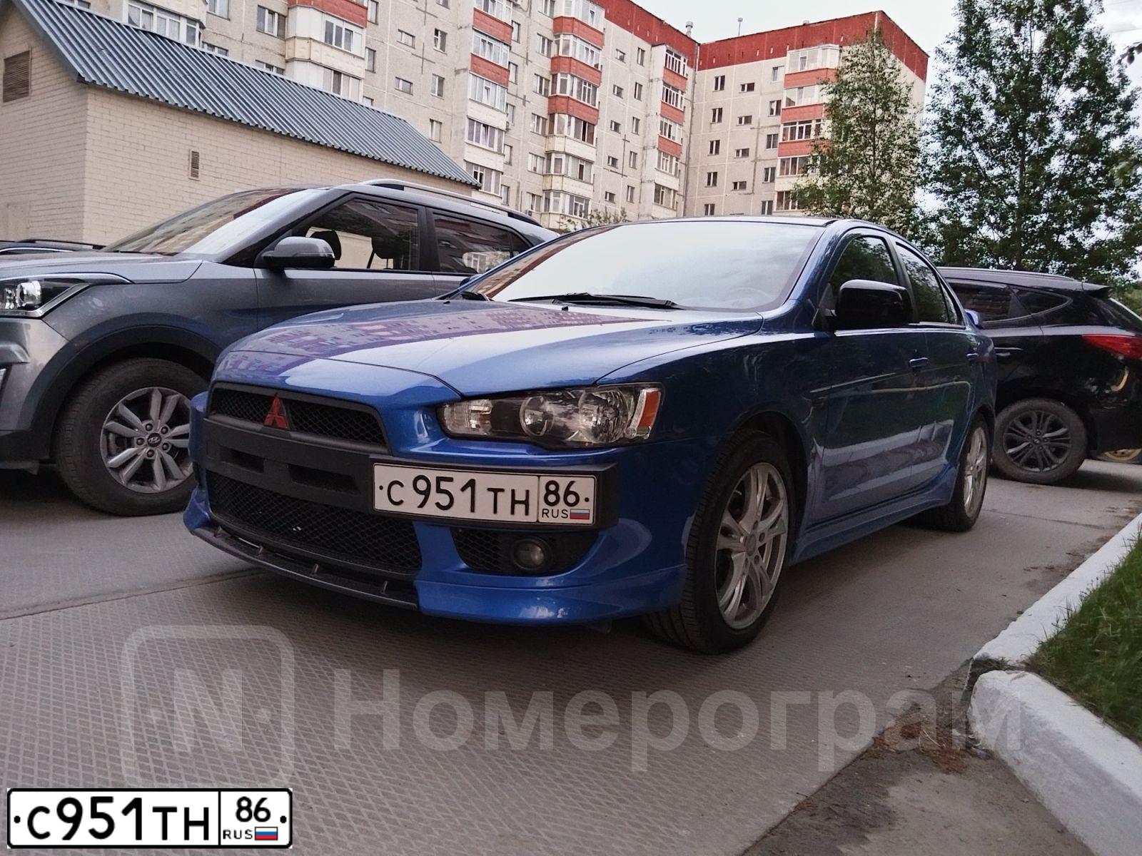 Фото автомобиля MITSUBISHI LANCER, 2008 — госномер С951ТН86. Цвет: СИНИЙ