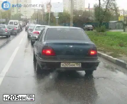Фото автомобиля DAEWOO NEXIA, 2004 — госномер Н205НН150. Цвет: СИНИЙ СЕРЫЙ