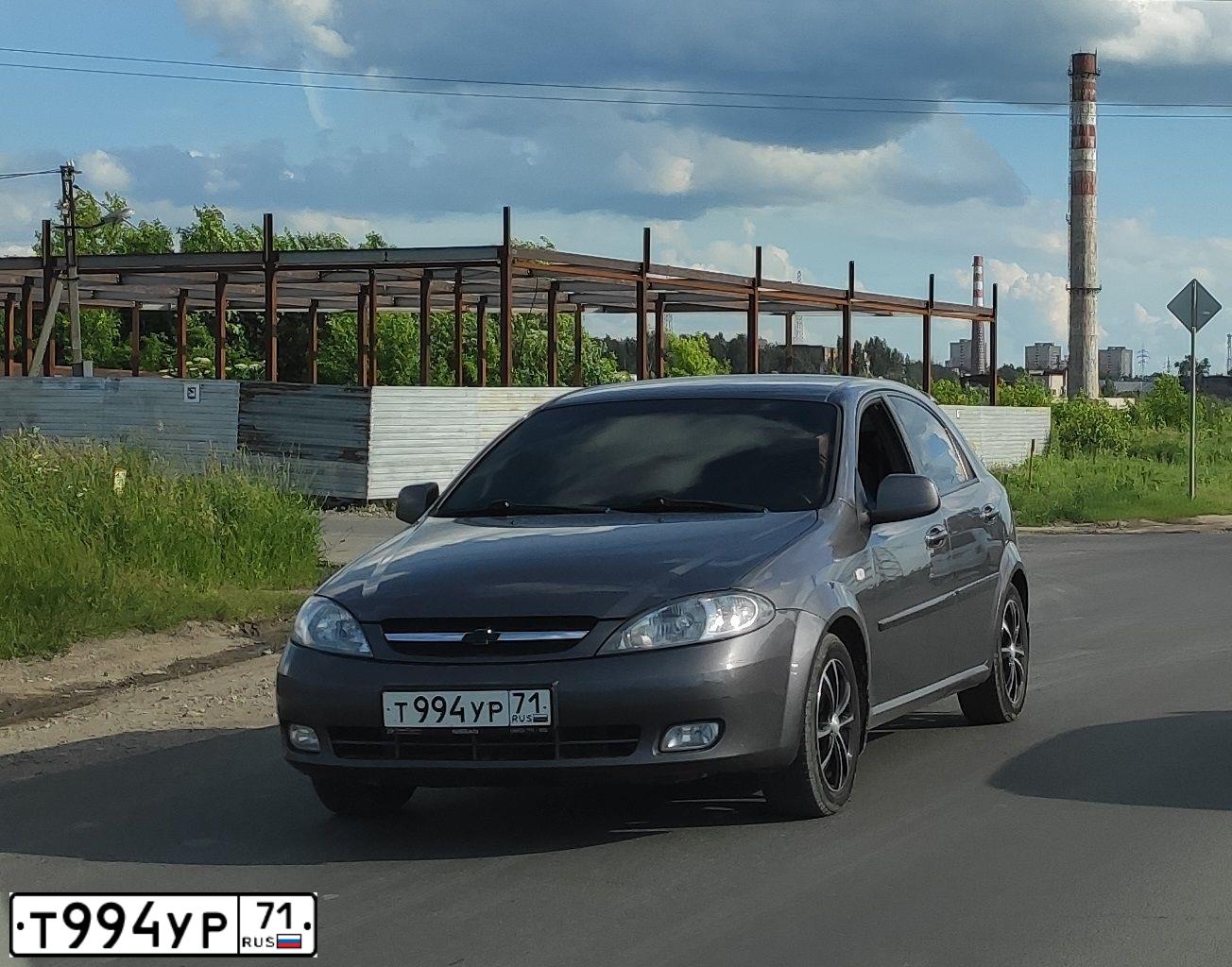 Фото автомобиля CHEVROLET LACETTI, 2012 — госномер Т994УР71. Цвет: СЕРЫЙ