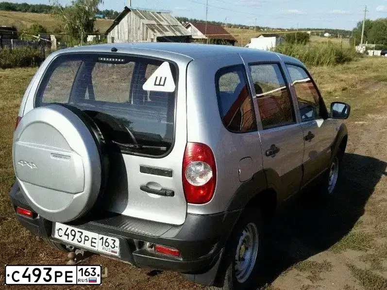 Фото автомобиля CHEVROLET NIVA, 2012 — госномер С344РА73. Цвет: Светло-Серебристый металлик
