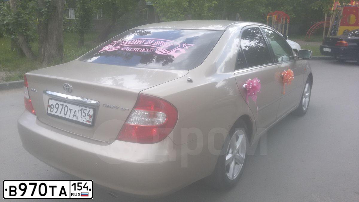 Фото автомобиля TOYOTA CAMRY, 2002 — госномер В970ТА154. Цвет: Серый