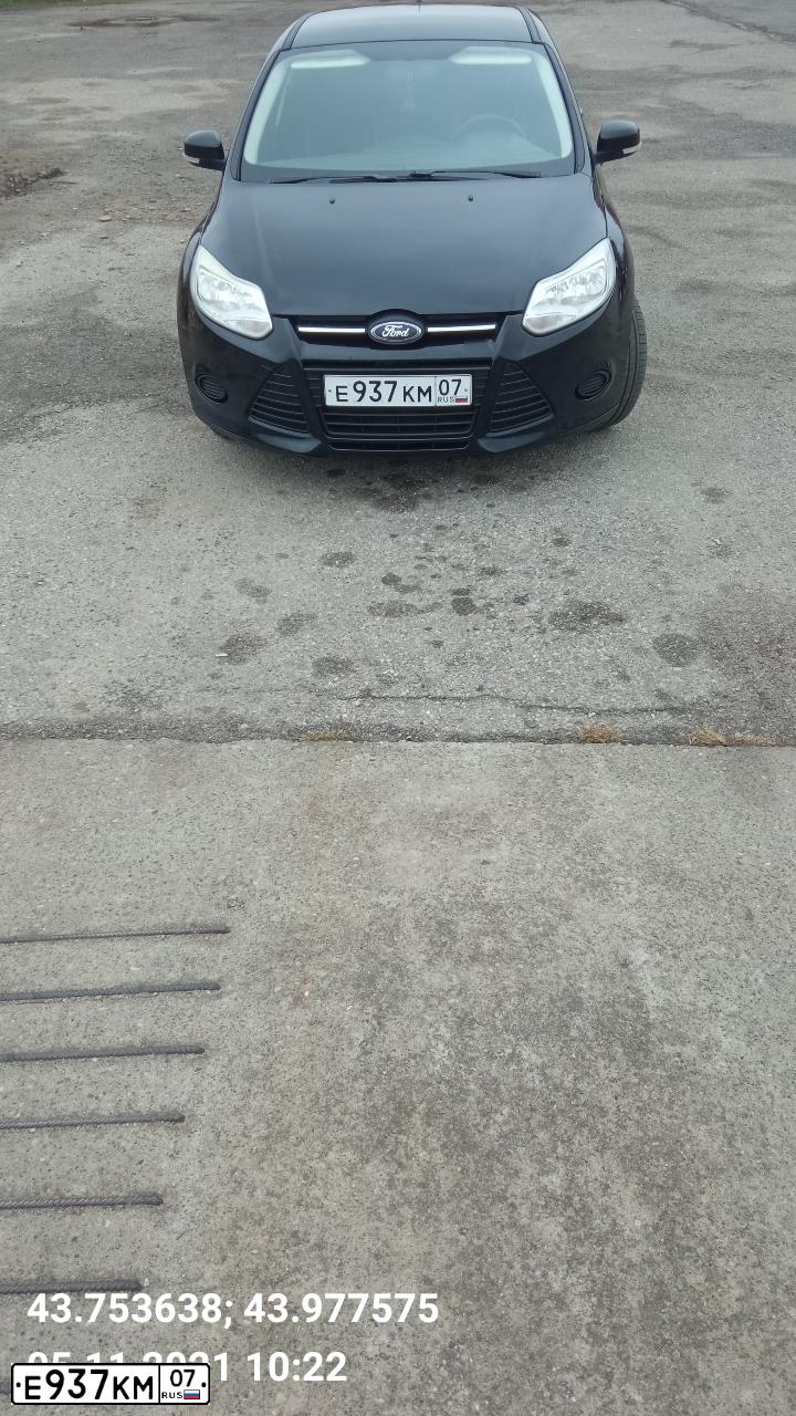 Фото автомобиля FORD FOCUS, 2011 — госномер Е937КМ07. Цвет: ЧЕРНЫЙ