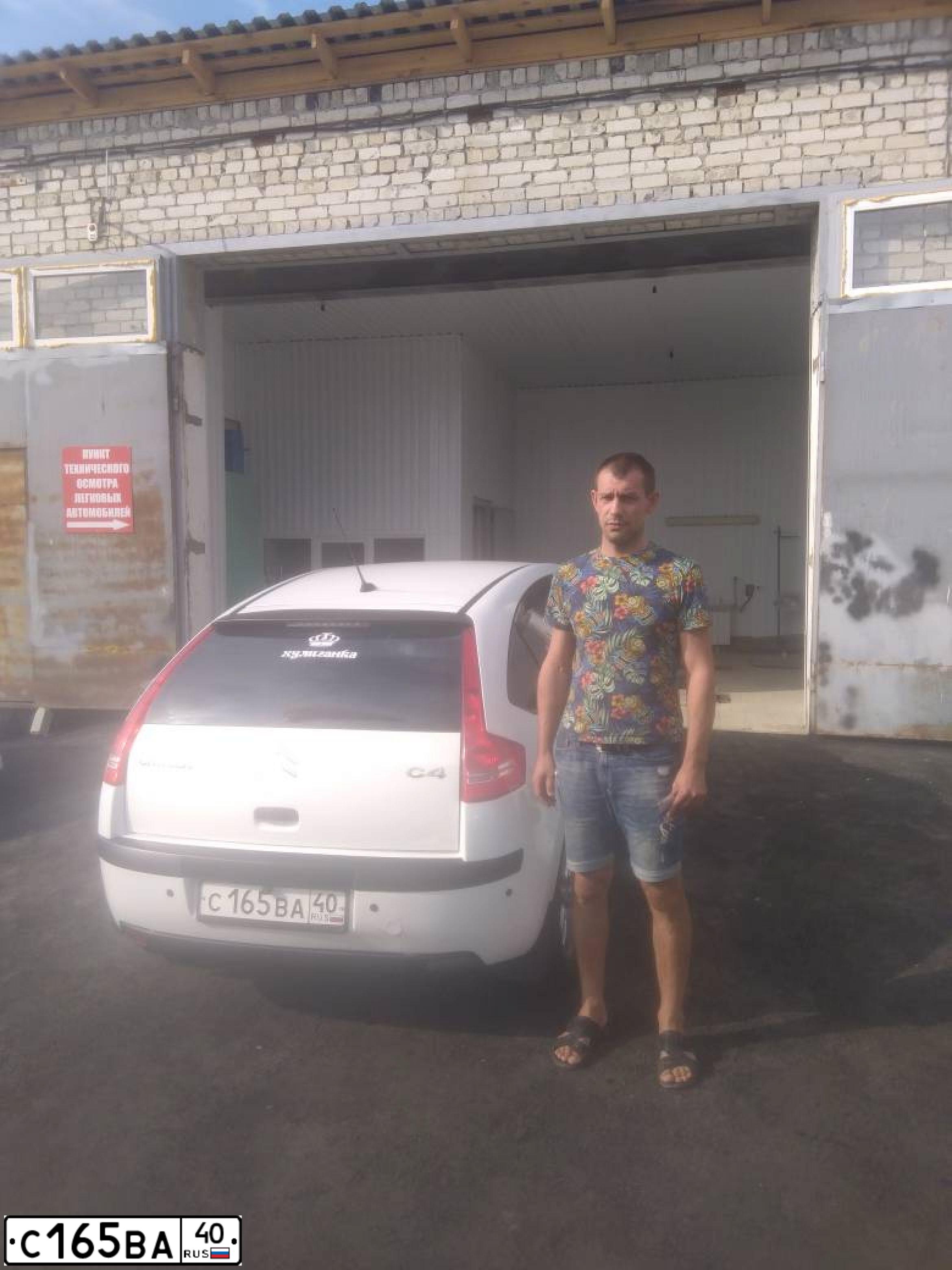 Фото автомобиля CITROEN C4, 2009 — госномер О545УУ40. Цвет: Белый