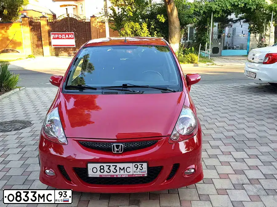 Фото автомобиля HONDA JAZZ, 2008 — госномер Т935ТК71. Цвет: Красный