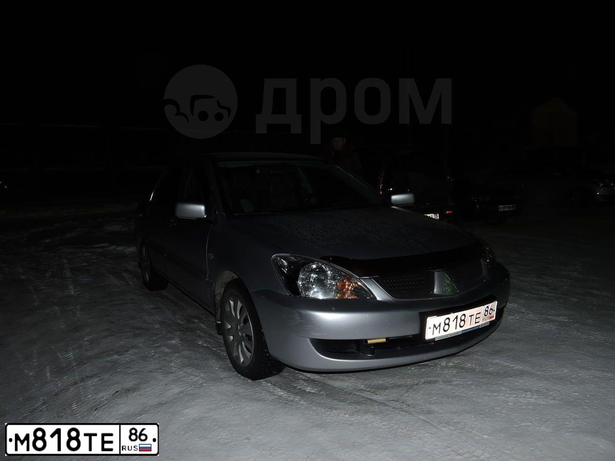 Фото автомобиля MITSUBISHI LANCER, 2005 — госномер М818ТЕ86. Цвет: Серебристый
