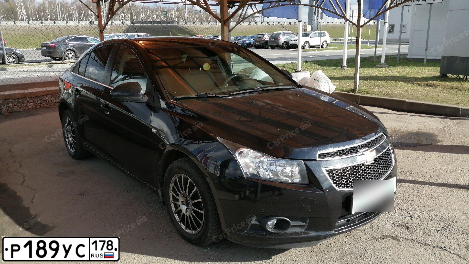 Фото автомобиля CHEVROLET CRUZE, 2010 — госномер Р128СК29. Цвет: ЧЕРНЫЙ