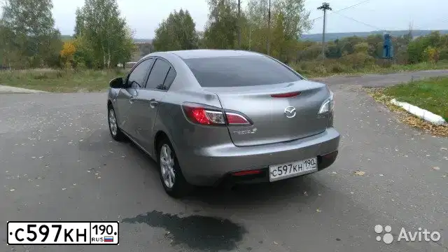Фото автомобиля MAZDA 3, 2009 — госномер С597КН190. Цвет: СЕРЫЙ СВЕТЛЫЙ