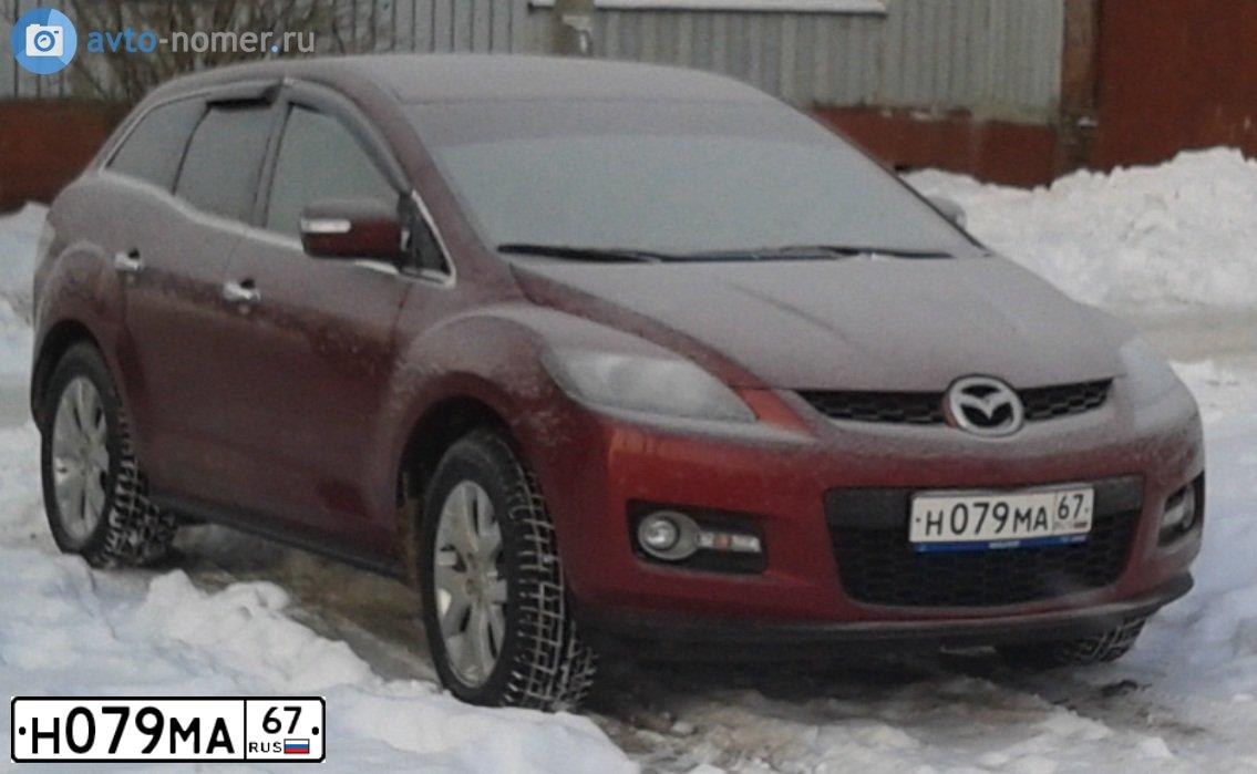 Фото автомобиля MAZDA CX-7, 2007 — госномер М499СХ67. Цвет: КРАСНЫЙ