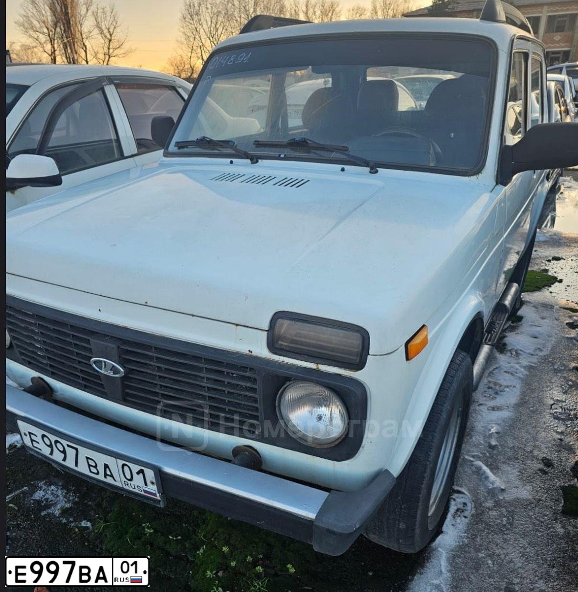 Фото автомобиля LADA 2121 NIVA, 2011 — госномер Е997ВА01. Цвет: ЯРКО-БЕЛЫЙ