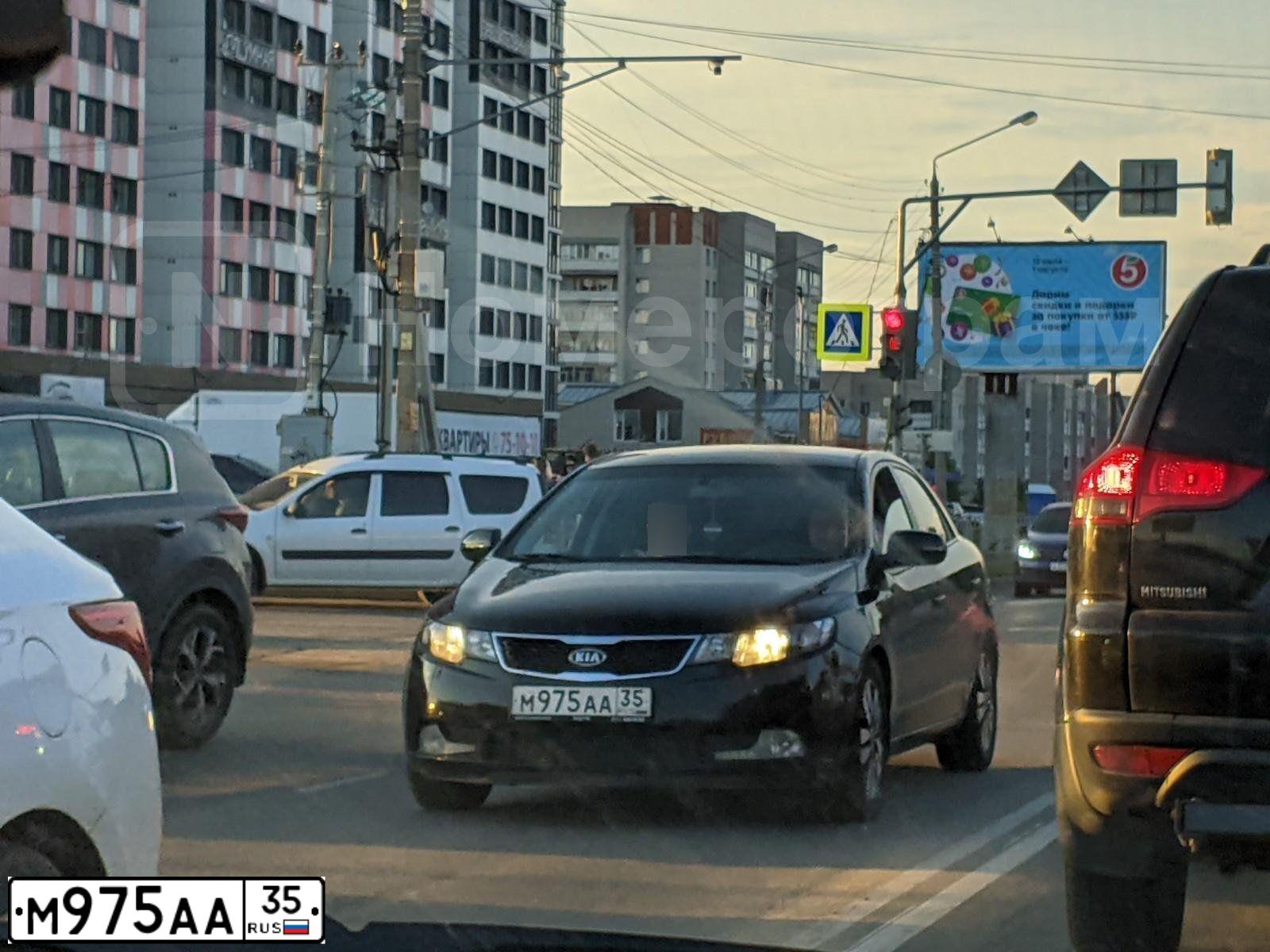 Фото автомобиля KIA CERATO, 2012 — госномер М975АА35. Цвет: ЧЕРНЫЙ