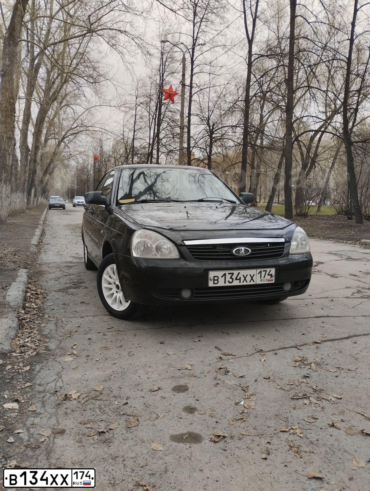 Фото автомобиля LADA 2170 PRIORA, 2009 — госномер В134ХХ174. Цвет: Сине-Черный