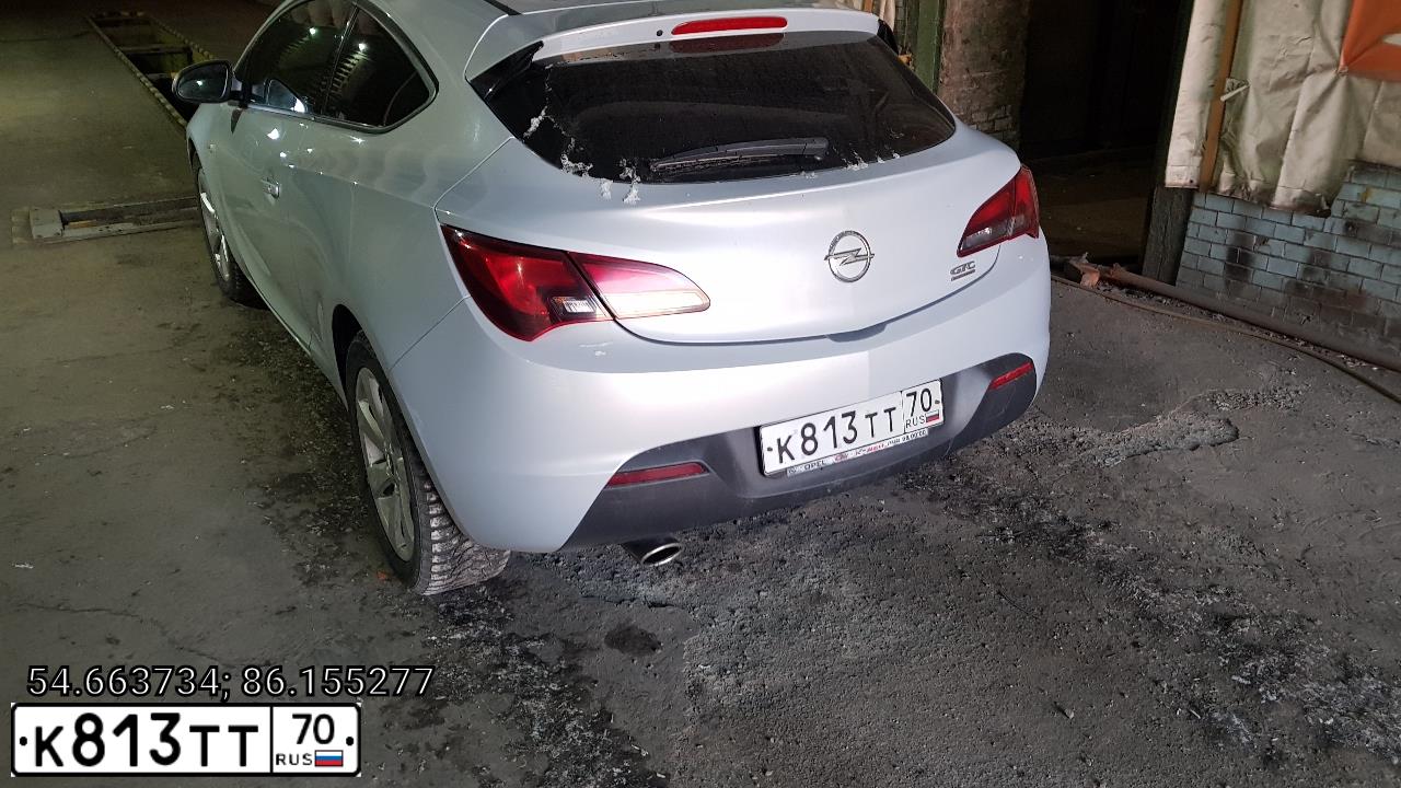 Фото автомобиля OPEL ASTRA, 2011 — госномер С700МО142. Цвет: Белый