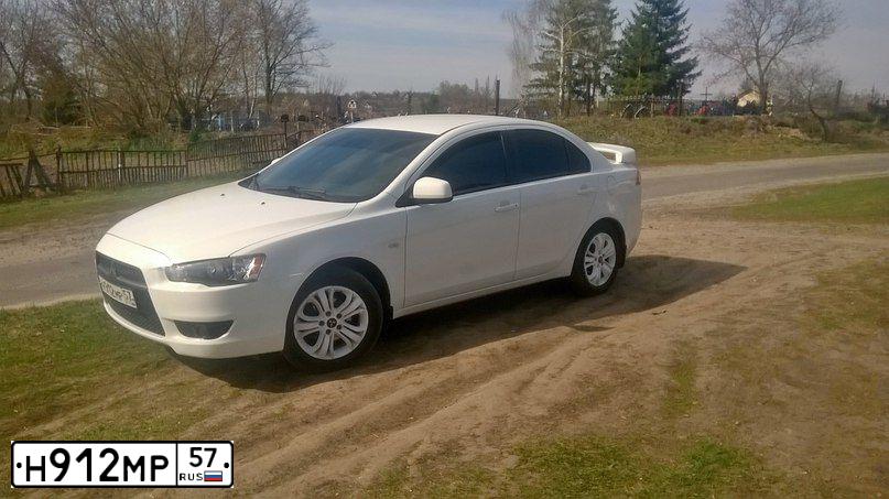 Фото автомобиля MITSUBISHI LANCER, 2007 — госномер Н912МР57. Цвет: БЕЛЫЙ