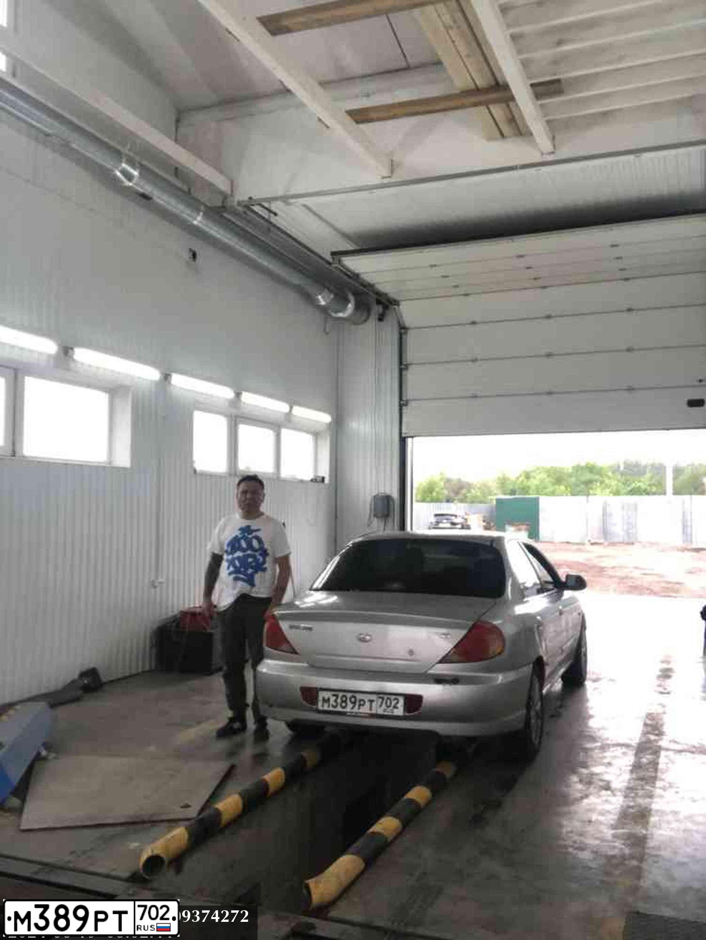 Фото автомобиля KIA SPECTRA, 2006 — госномер М389РТ702. Цвет: СВЕТЛО-СЕРЫЙ