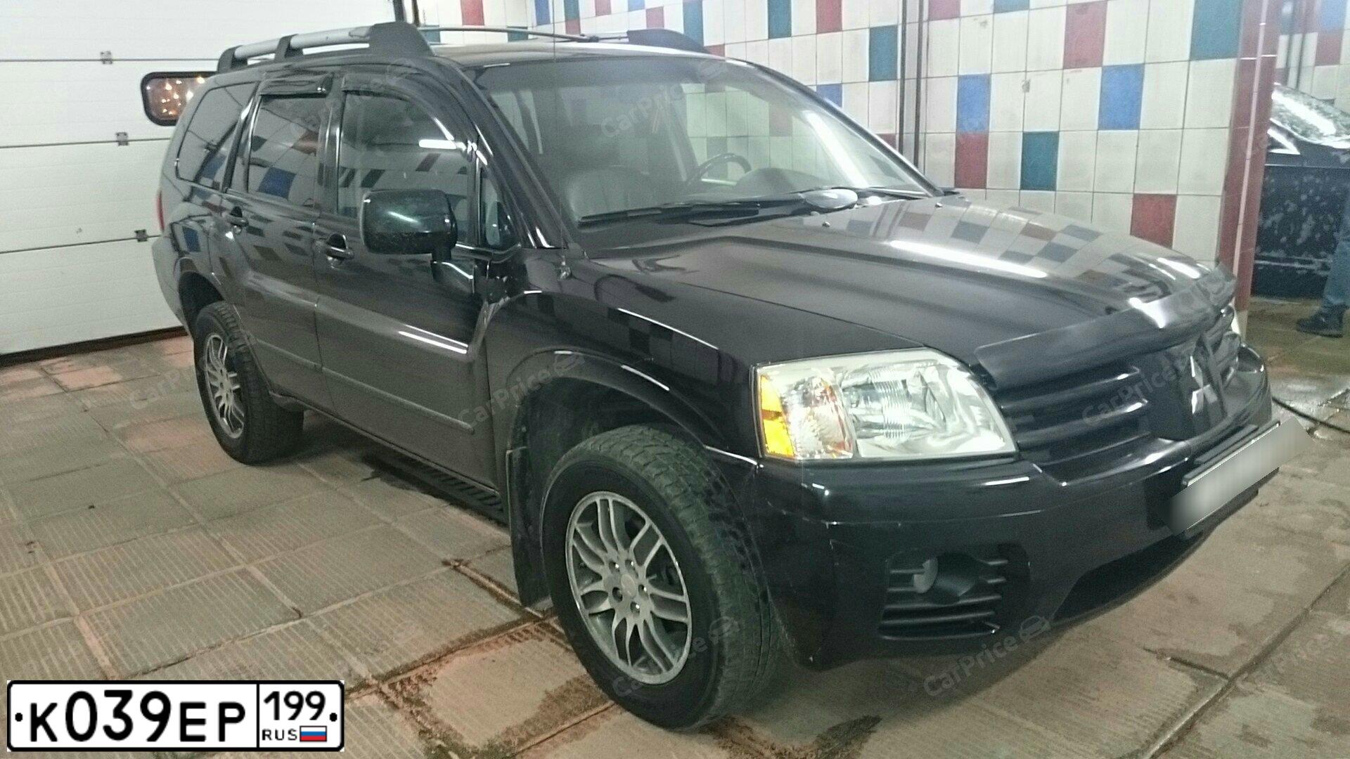 Фото автомобиля MITSUBISHI ENDEAVOR, 2003 — госномер В851УУ09. Цвет: ЧЕРНЫЙ